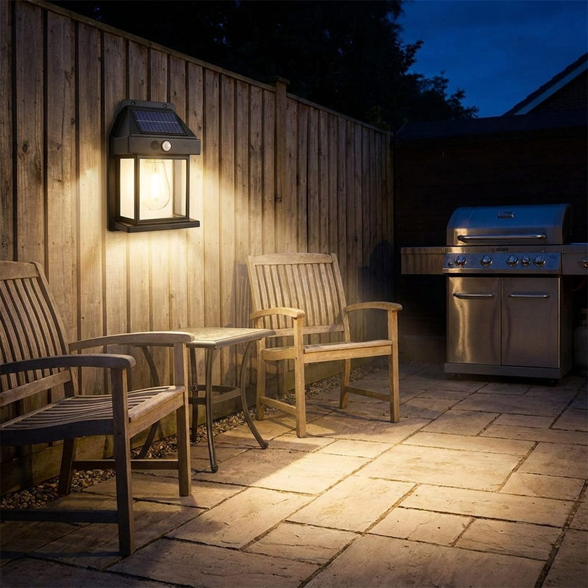 Solar wall light on backyard fence at night