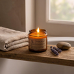Brown glass candle on bathroom shelf spa