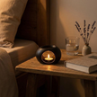 Ceramic oil burner on bedside table at night